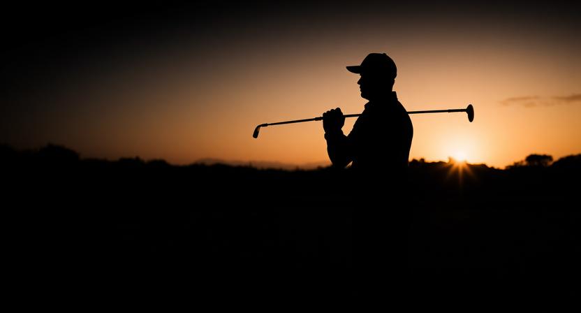 Golfer practicing breathing techniques inspired by flute exercises